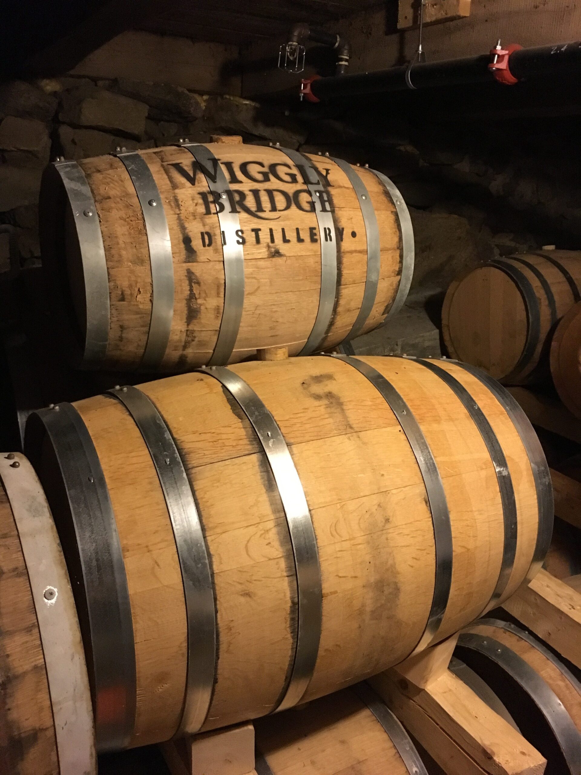 image of two barrels sitting in a wiggly bridge barn