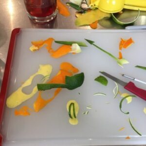 a garnish made out of lemon and limes turned into a mini flip flop